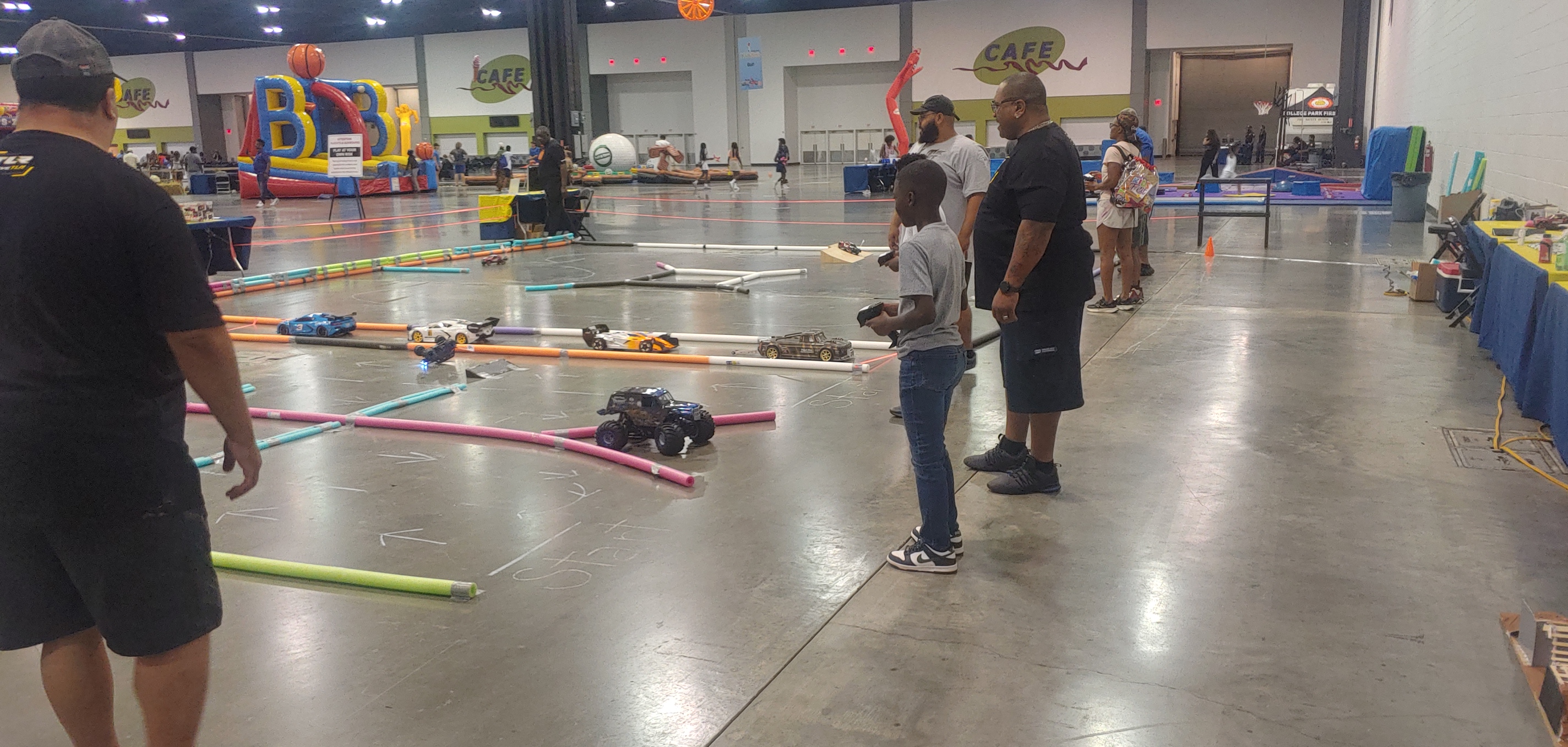 Kids playing RC cars at Little Kingdom Builder event